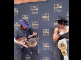 Young Fan's Bold Move: Shoves Dominik Mysterio for a Private Photo with Rhea Ripley at Meet & Greet