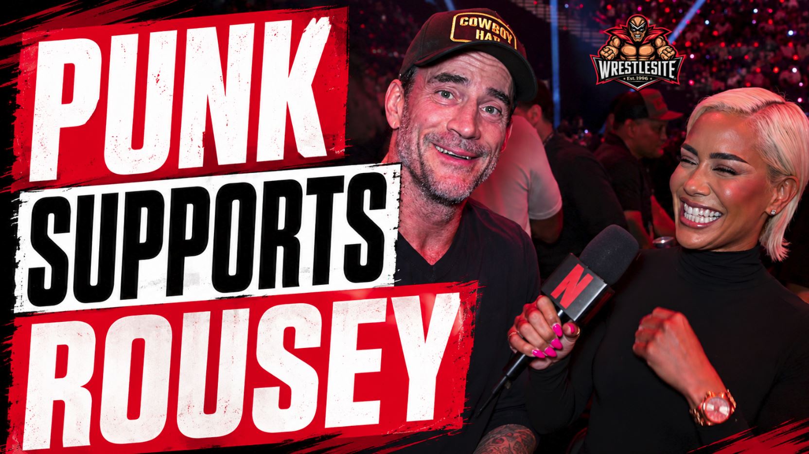 CM Punk watches from the crowd as Ronda Rousey faces Gina Carano during Netflix MMA event